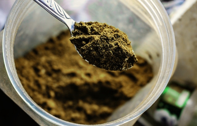 Kratom powder in a jar