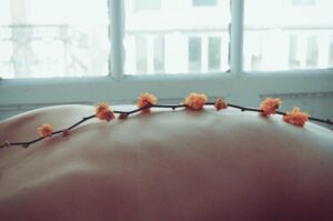 Orange flowers on a naked back
