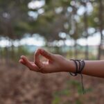 A hand practicing yoga