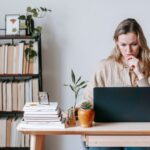 A woman looking at a computer