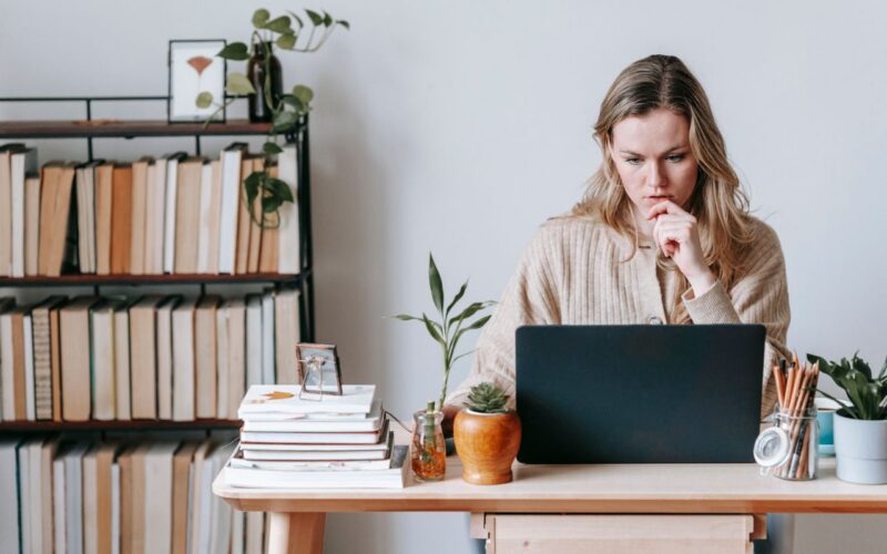 A woman looking at a computer